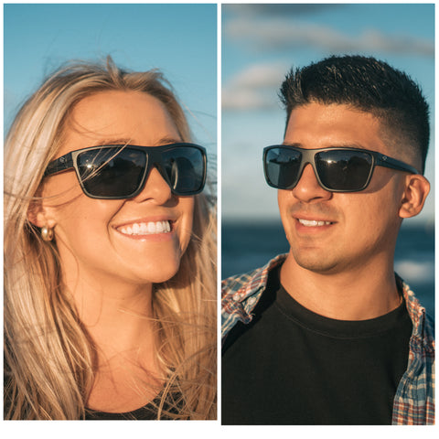 a man and a woman wearing the Black Ghost glasses