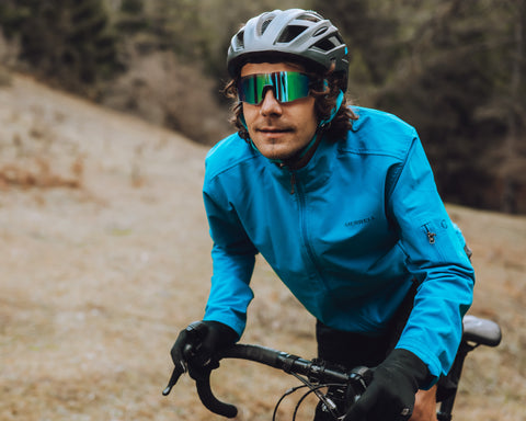 a man cyling on the road wearing Torege cycling sunglasses