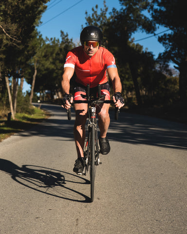 a man cycling wearing Torege cycling sunglasses