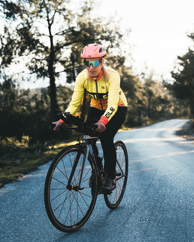 a woman cycling on the path
