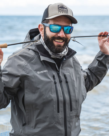a fisherman enjoying his enjoying his sea fishing experience wearing Torege polarized sunglasses