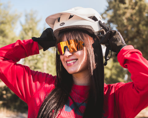 a woman cyclist wearing Torege cycling sunglasses 
